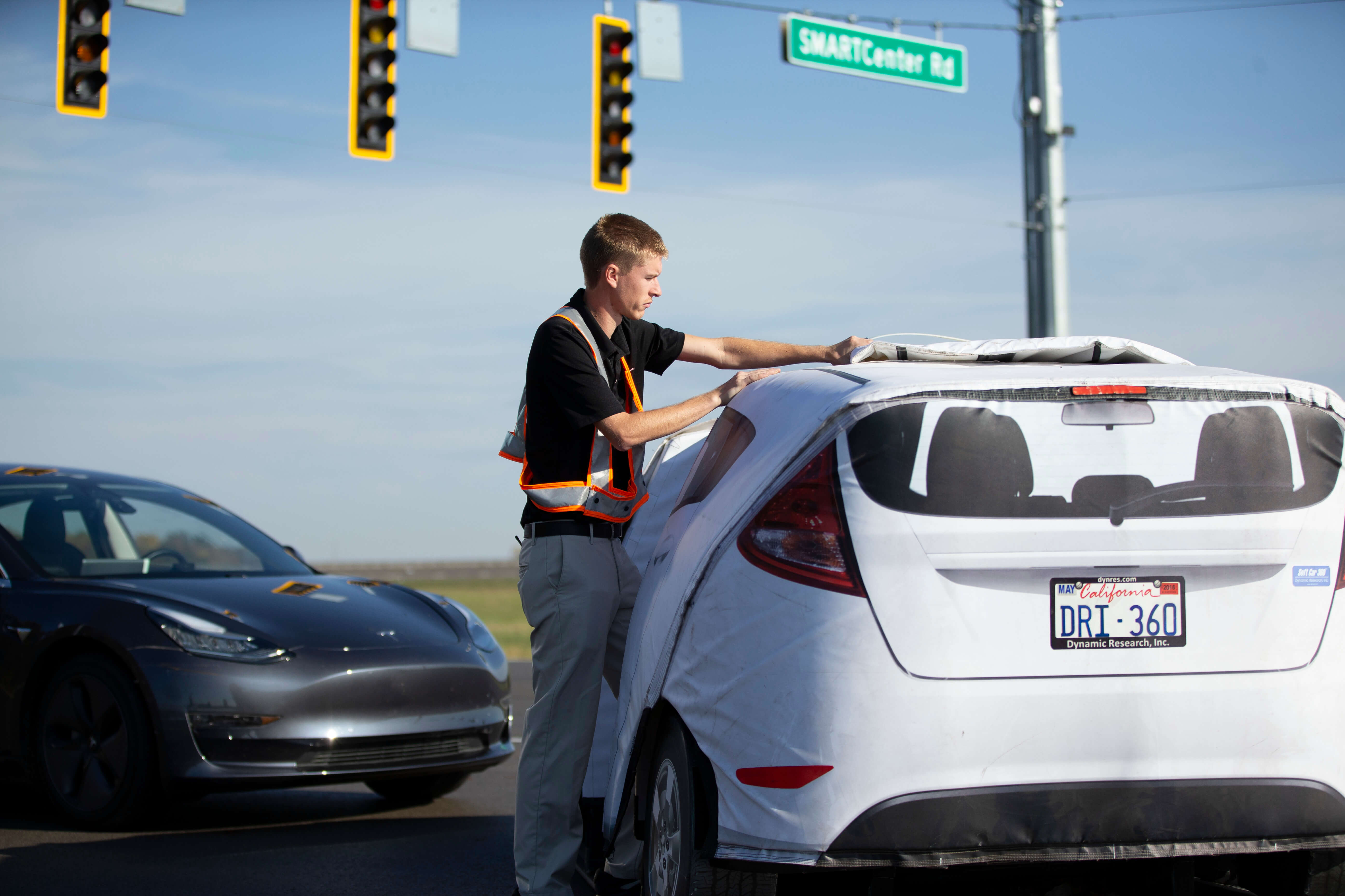 TRC Employee Taking Cover Off Car