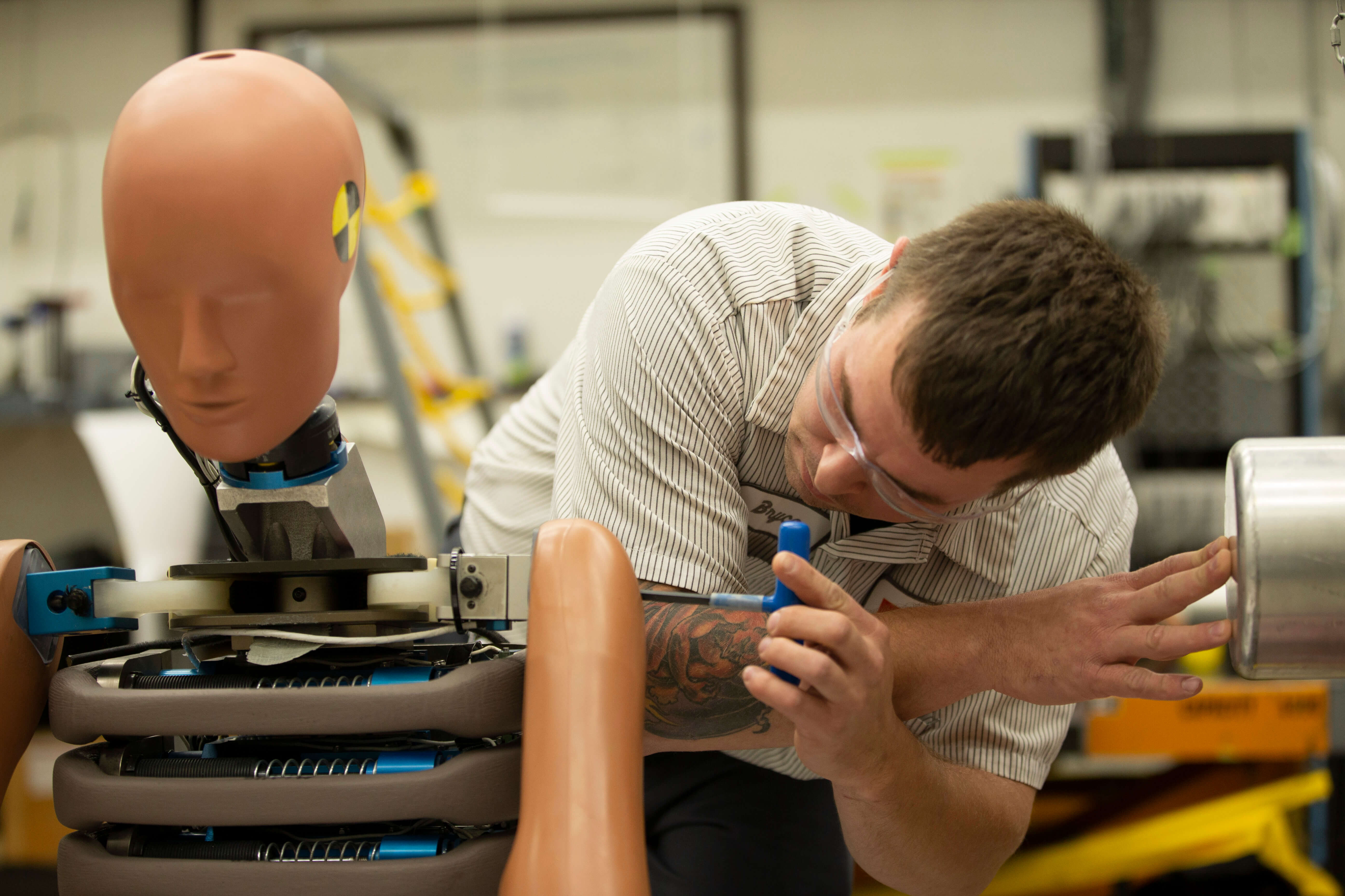 TRC Employee In Impact Lab With Mannequin Head